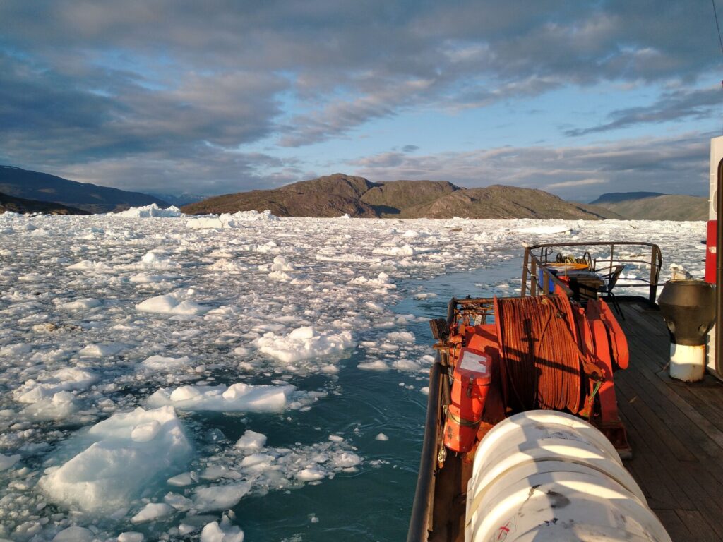 Ship in water with ice.