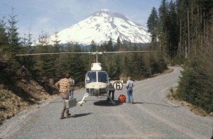 Image of Mount St Helens prior to the eruption, PNSN researchers getting into a helicopter.