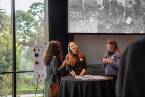 Department community members socializing at the ESS 130th Anniversary Celebration in the Burke Museum.