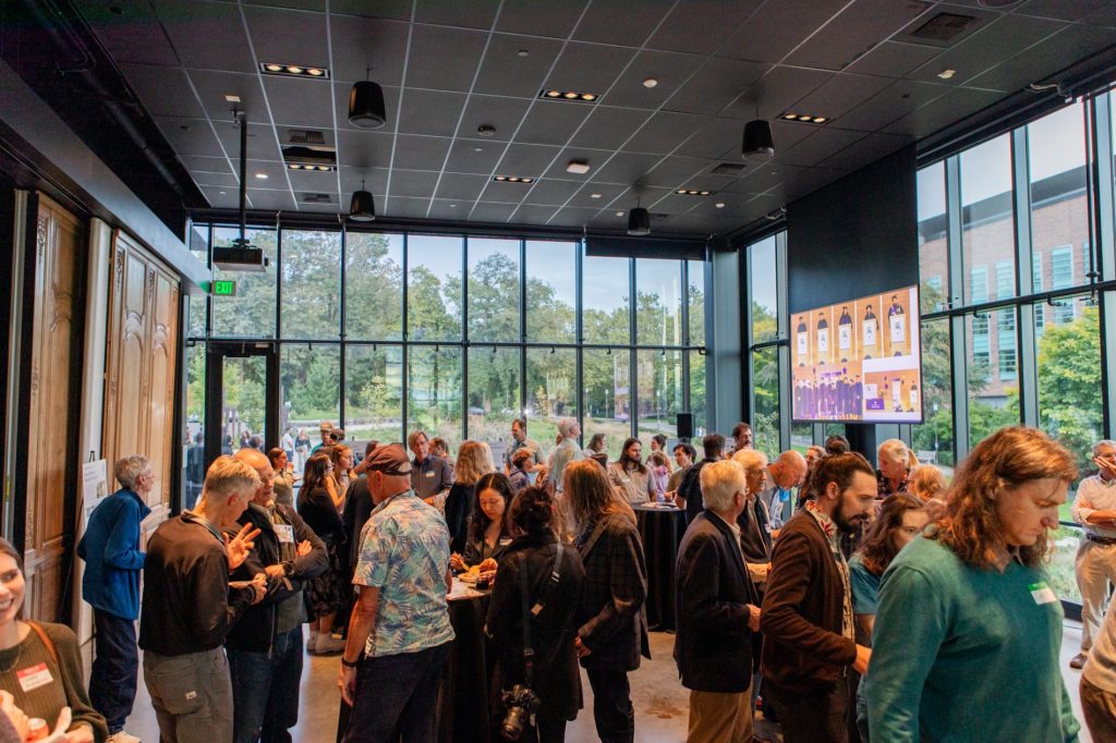 Department community members socializing at the ESS 130th Anniversary Celebration in the Burke Museum.