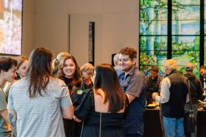 Department community members socializing at the ESS 130th Anniversary Celebration in the Burke Museum.