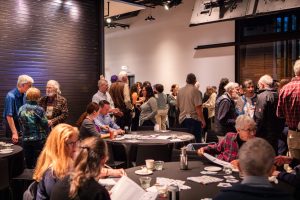 Department community members socializing at the ESS 130th Anniversary Celebration in the Burke Museum.