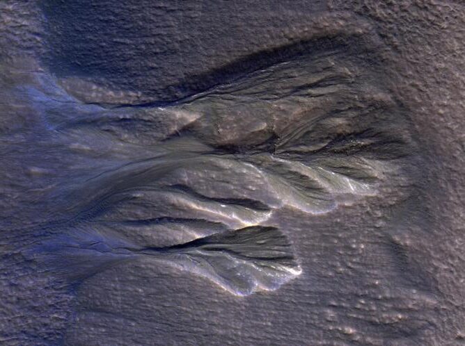 White-edged mounds on a dark background.