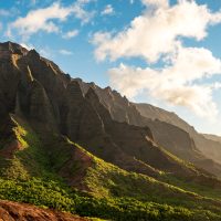 Ridges of basalt cliffs meeting the Pacific Ocean above Kalalau Beach on Kauai.