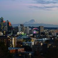 A view of the city of Seattle along with the Space Needle, downtown, Elliot Bay and Mount Rainier.