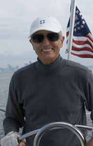 A close-up of Professor Emeritus Bob Crosson on a sailboat.