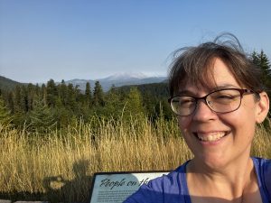 A close up of Leigh Tucker at the Mount St. Helens overlook.