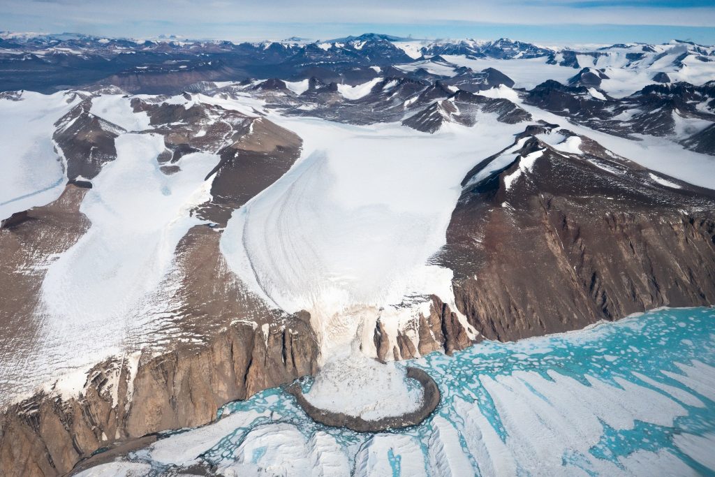 Glacial moraine surrounded by mountains.